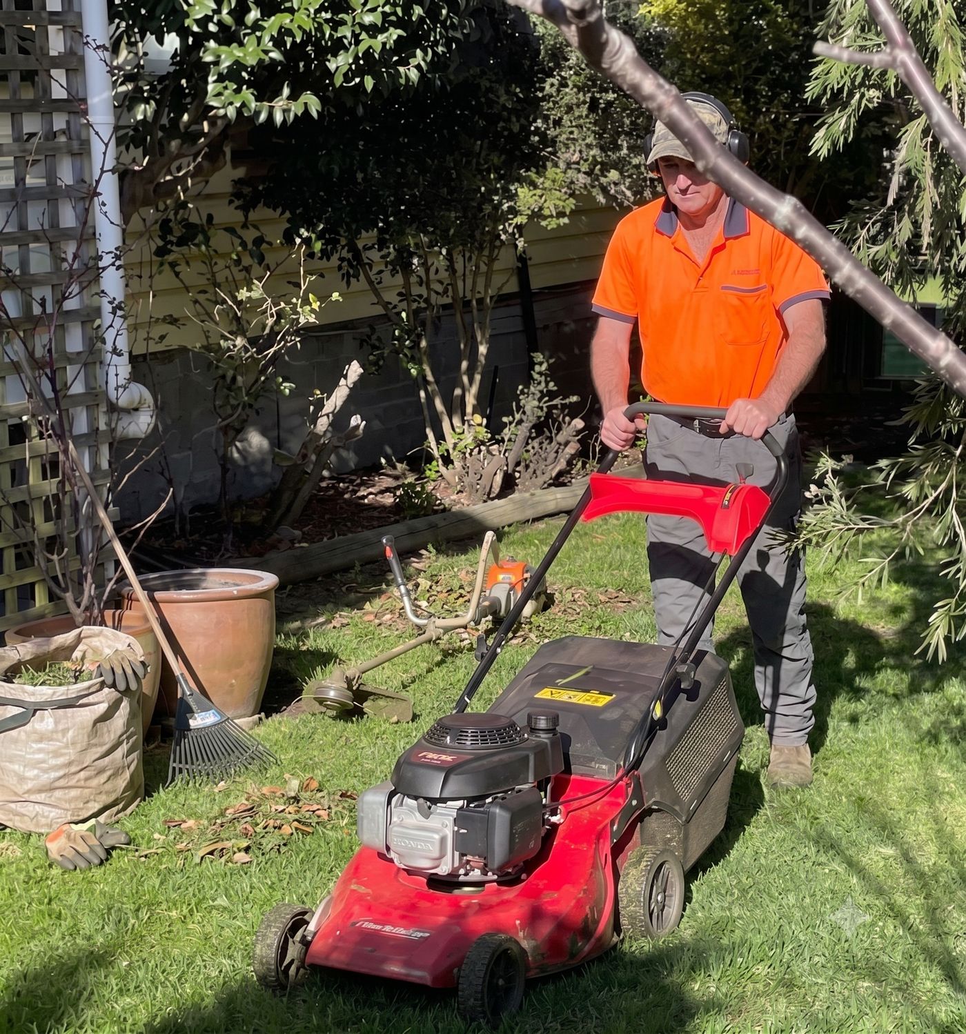 Steve from Pasturesnz mowing a lawn in Tawa